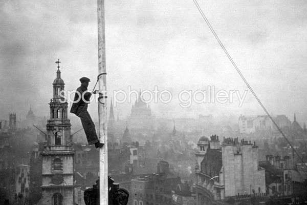 Steeplejack with view over London behind 1934