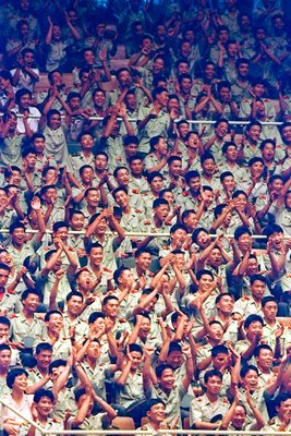 Chinese soldiers watch Volleyball game