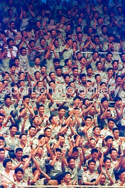 Chinese soldiers watch Volleyball game