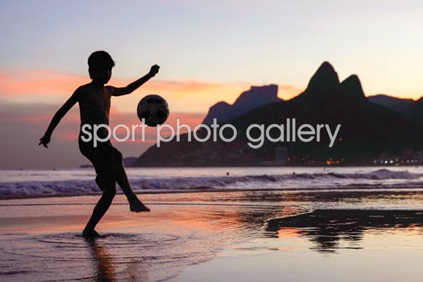 Juggling a football on Ipanema Beach