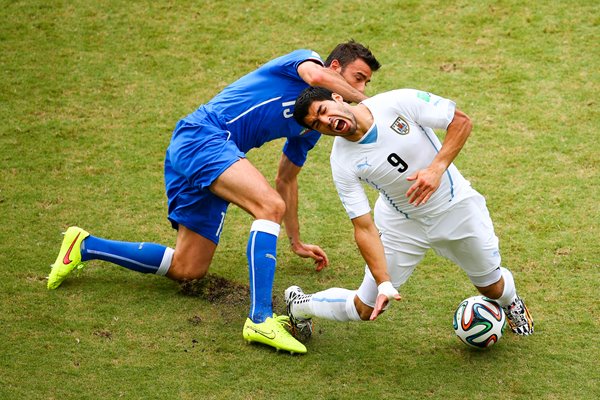 Andrea Barzagli challenges Luis Suarez