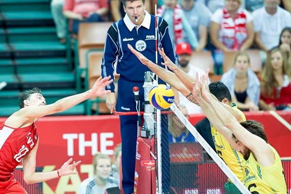 Sergey Savin of Russia spikes the ball v Brazil 