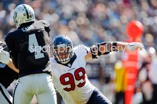  Derek Carr Oakland takes hit  J.J. Watt Houston