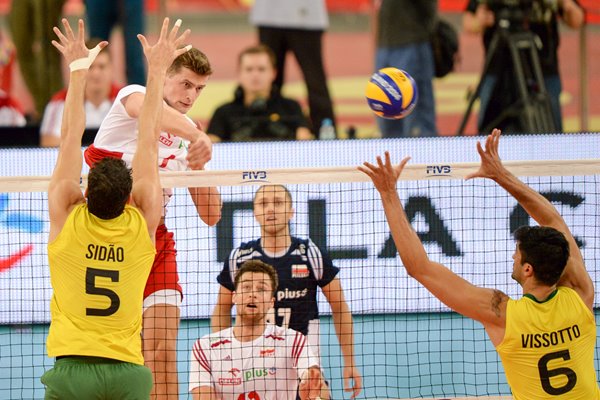 Piotr Nowakowski Poland spikes the ball v Brazil