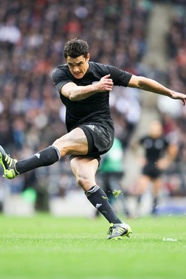 Dan Carter of New Zealand kicks at goal