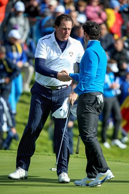 Phil Mickelson hakes hands with Rory McIlroy Ryder Cup