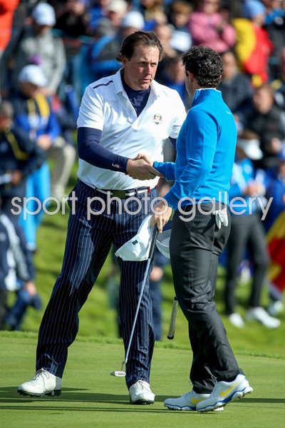 Phil Mickelson hakes hands with Rory McIlroy Ryder Cup