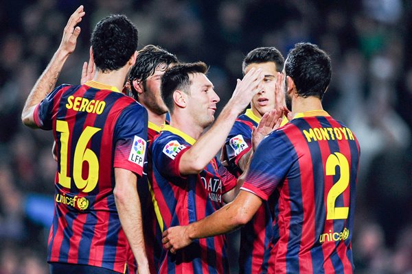 Messi of Barcelona celebrates with teammates