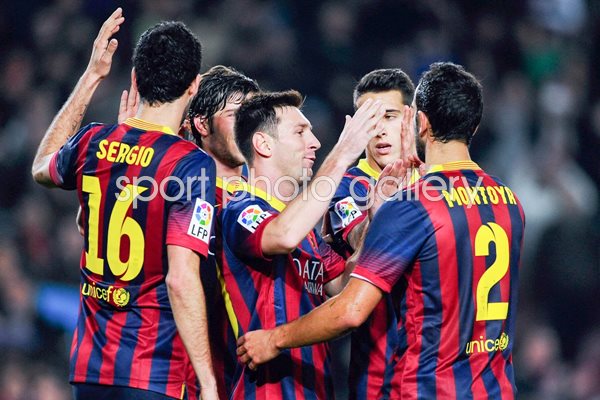 Messi of Barcelona celebrates with teammates