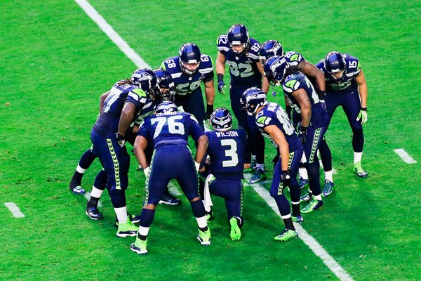 Team Huddle Seahawks v Patriots Glendale 2015