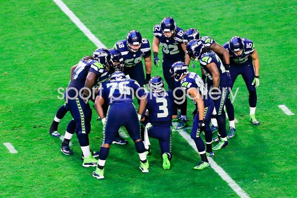Team Huddle Seahawks v Patriots Glendale 2015